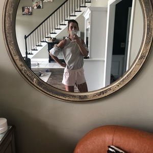 Gray cold-shoulder arm cuff blouse.